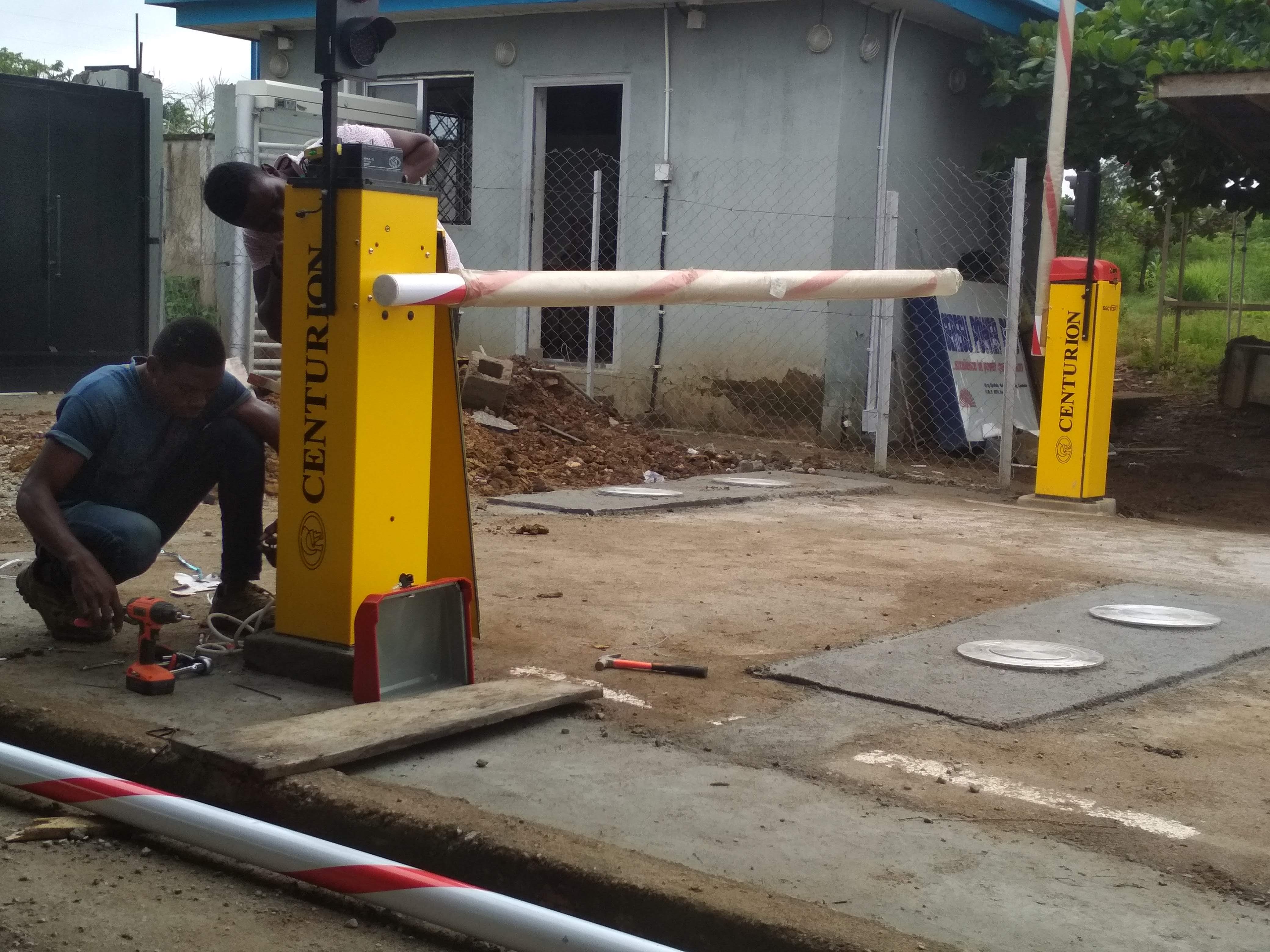 Professional Protego technicians installing security barrier gate and access control systems in Nigeria